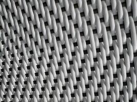 White woven texture displayed closely with a pattern of interlacing strands photo