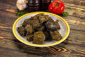Stuffed dolma - meat in grape leaves photo