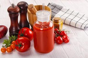 Fresh Tomato juice in the glass photo