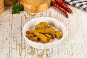 Raw dry Tumeric roots heap photo