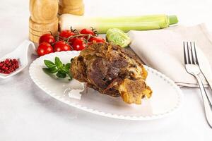 Baked Lamb shank with bone photo