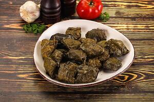 Stuffed dolma - meat in grape leaves photo