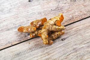 Fresh young Tumeric root heap photo