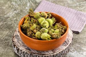 Fresh green ripe hazelnut heap photo