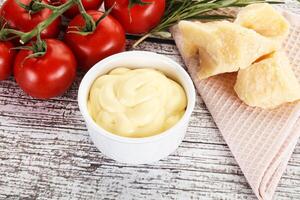 Cheese sauce in the bowl photo
