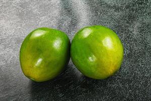 Two ripe green exotic avocado fruit photo