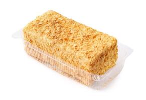 Layered dessert made with cake crumbs in a clear plastic container for a sweet treat photo