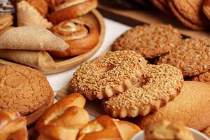 Exquisite assortment of baked treats displayed on a rustic table for an afternoon gathering photo