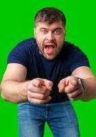 A man excitedly pointing and expressing enthusiasm against a vibrant green background photo