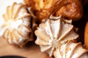 Delicious pastries arranged on a wooden board inviting a delightful culinary experience in a cozy setting photo