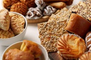 Delicious assortment of bakery treats displayed on a table at a festive gathering photo