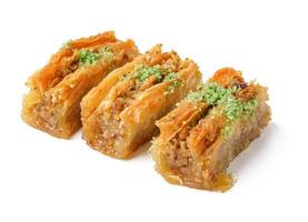 Delicious layers of baklava drizzled with syrup and topped with pistachios on a minimalist background photo