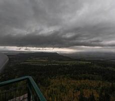 Autumn rainy sky over mountains, autumn mountains from above. Drone view. Poland, Table Mountains. photo