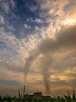 Smoke from the boiler stack and the vapor from a cooling tower in the power plant photo
