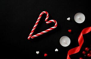 Hearts and candles on a dark background. The concept of celebrating Valentine's Day, Mother's Day photo
