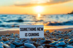 Something new is coming message written on white card on sea background. Conceptual something new is coming symbol. Copy space. photo