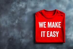 We make it easy message written on red t-shirt on dark background. Conceptual we make it easy symbol. Copy space. photo