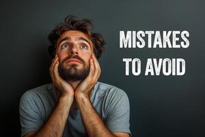 Young man with mistakes to avoid message on gray background. Conceptual mistakes to avoid symbol. Copy space. photo