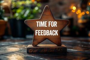 Time for feedback message written on wooden star shape. Conceptual time for feedback symbol. Copy space. photo