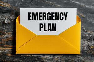 Emergency plan message written on yellow envelope. Conceptual emergency plan symbol. Copy space. photo