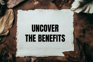 Uncover the benefits message written on ripped torn white paper photo