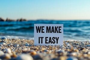 We make it easy message written on white card on sea background. Conceptual we make it easy symbol. Copy space. photo