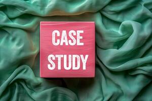 Case study message written on pink wooden cube on green fabric background. Conceptual case study symbol. Copy space. photo