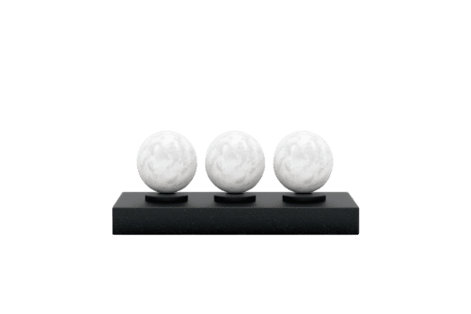 três esférico objetos arranjado dentro uma linha em uma retangular base, exibindo uma suave, branco superfície com sutil textura. png