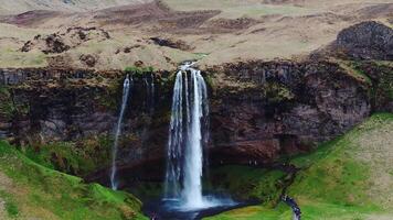 Seljalandsfoss Waterfall Cascading Over Rocky Cliff in Iceland video