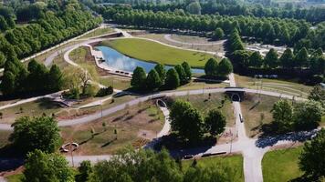 Aerial View of Urban Park with Winding Paths and Central Pond video