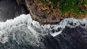 Aerial View of Iceland's Basalt Columns and Crashing Waves video