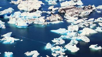 Icebergs in Jokulsarlon Glacier Lagoon with Volcanic Ash Streaks video