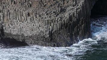 Basalt Columns of Reynisfjara Beach Meeting the Atlantic Ocean video
