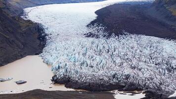 Icelandic Glacier with Crevasses and Volcanic Rock Formations video