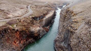 Basalt Columns of Studlagil Canyon with Winding River in Iceland video