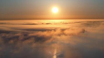 Sunrise Over Clouds with Silhouette of Distant Landmark video