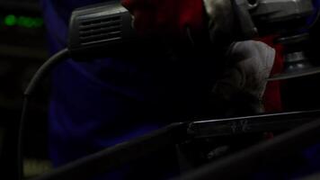 Worker Using Angle Grinder with Sparks in Industrial Setting video