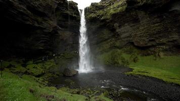 Waterfall Cascading into Pool in Iceland's Rugged Terrain video