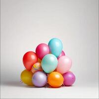 Colorful balloons in various shades stacked together, creating festive and cheerful atmosphere. Perfect for celebrations, parties, and events photo