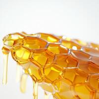 Golden honeycomb dripping with fresh honey, showcasing its natural texture and rich color. close up highlights hexagonal pattern and viscous flow of honey photo