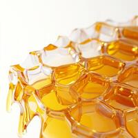close up of honeycomb structure with golden honey dripping, showcasing its intricate geometric pattern and glossy texture. image highlights natural beauty and richness of honey photo