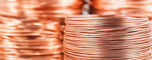 Manufacturing on raw material supply. Copper wire coils stacked together in a close-up view. photo