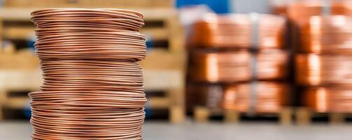 Manufacturing on raw material supply. Stacks of copper wire in a warehouse setting. photo