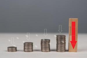 A stack of coins and a red arrow pointing up photo