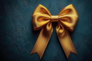 A gold ribbon bow is on a blue background photo