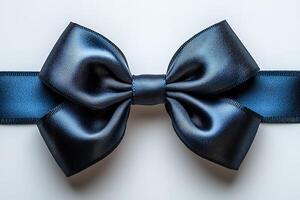A blue ribbon bow is on a white background photo