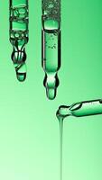 Pipette serum drop with niacinamide, hyaluronic or Aha Bha acids on a green isolated background photo