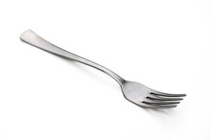 Unique stainless steel fork resting elegantly on a clean, white background highlighting its shiny finish and design photo