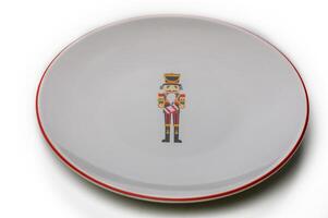 Decorative plate featuring a whimsical nutcracker design for festive occasions photo