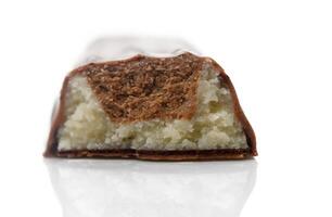 Decadent chocolate bar revealing soft, creamy filling with almond flavor in elegant setting photo
